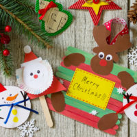 Christmas merry gift on wooden table - Santa, Reindeer and snowman toys. Handmade. Project of children's creativity, handicrafts, crafts for kids.